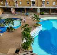 Swimming Pool 5 Studio Minimalist and Comfy Pluit Sea View Apartment By Travelio