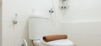 In-room Bathroom 6 2BR Simply at Bassura City Apartment By Travelio