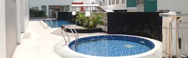 Swimming Pool 2 2BR Comfortable Apartment at Pavilion Permata By Travelio