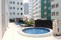 Swimming Pool 2BR Comfortable Apartment at Pavilion Permata By Travelio