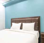 Bedroom 5 Vibrant Soho Studio Room Apartment at Pakubuwono Terrace By Travelio