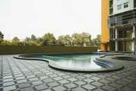 Swimming Pool 2BR Modern With City View @ Pancoran Riverside Apartment By Travelio