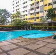 Swimming Pool 2 2BR Comfortable Apartment at Sentra Timur Residence By Travelio