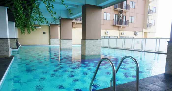 Swimming Pool 2BR Cozy Tamansari Panoramic Apartment By Travelio