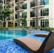 Swimming Pool 2 2BR Comfortable Puri Orchard Apartment By Travelio