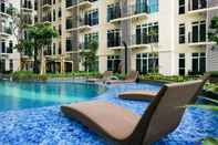 Swimming Pool 2BR Comfortable Puri Orchard Apartment By Travelio