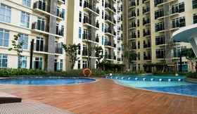 Kolam Renang 2 2BR Simply Furnished at Puri Orchard Apartment By Travelio