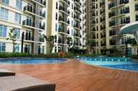 Swimming Pool 2BR Simply Furnished at Puri Orchard Apartment By Travelio