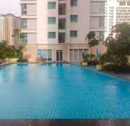 Swimming Pool 2 Minimalist 2BR Apartment at Springhill Terrace Residence By Travelio