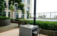 Khu vực công cộng 6 2BR Comfy Puri Orchard Apartment By Travelio