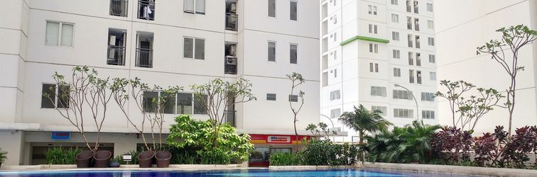 Lobby 2BR City View Apartment Bassura City near Shopping Mall By Travelio