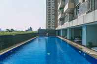 Swimming Pool 2BR Wonderful Apartment at Belmont Residence Puri By Travelio