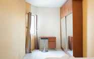 Bedroom 3 2BR Warm Apartment Cibubur Village By Travelio