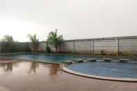 Swimming Pool 1BR Homey at Enviro Apartment Cikarang By Travelio