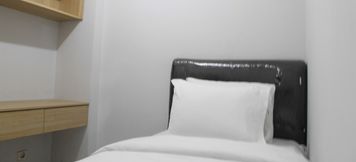 Bedroom 2 Young and Trendy 2BR Kalibata City Apartment By Travelio