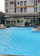 SWIMMING_POOL 2BR Minimalist Style Pakubuwono Terrace Apartment By Travelio