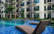 Swimming Pool 3 1BR Cozy at Puri Orchard Apartment By Travelio
