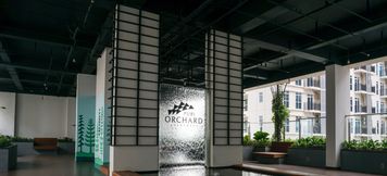 Lobby 6 1BR Cozy at Puri Orchard Apartment By Travelio
