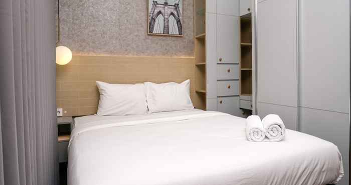 Bilik Tidur 1BR Cozy at Puri Orchard Apartment By Travelio