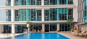 Swimming Pool 2 Cozy Studio Room Apartment at Brooklyn Alam Sutera By Travelio