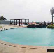 Swimming Pool 3 1BR Minimalist and Comfy at Grand Kamala Lagoon Apartment By Travelio