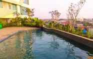 Swimming Pool 6 Cozy 1BR Apartment at Grand Kamala Lagoon By Travelio