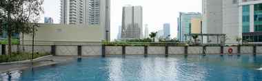 Swimming Pool 2 1BR Highest Value at The Wave Apartment By Travelio