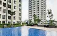 Swimming Pool 4 2BR Elegant Apartment at M-Town Signature near Mall By Travelio