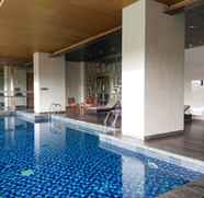 Swimming Pool 3 1BR Elegant Kemang Village Apartment By Travelio