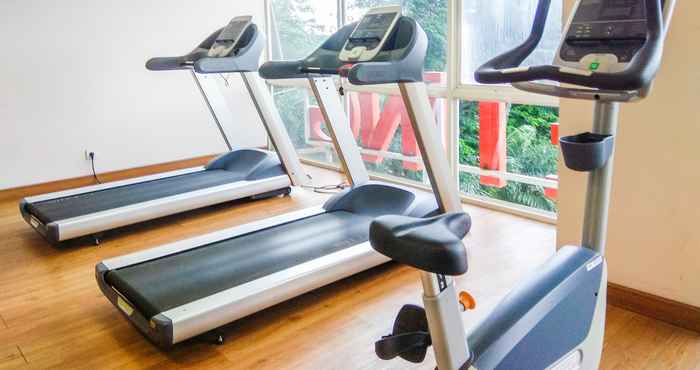 Fitness Center Studio Tifolia Apartment with Double Bed near LRT Station By Travelio