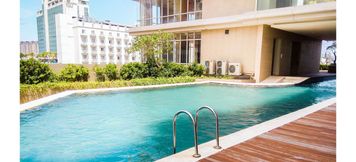Swimming Pool 4 2BR Apartment at Elpis Residence near Ancol By Travelio