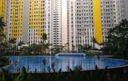 Swimming Pool 7 2BR Simply and Cozy at Springlake Bekasi Apartment By Travelio