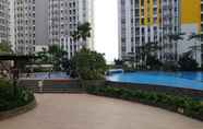 Swimming Pool 5 2BR Simply and Cozy at Springlake Bekasi Apartment By Travelio