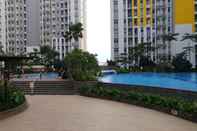 Swimming Pool 2BR Simply and Cozy at Springlake Bekasi Apartment By Travelio