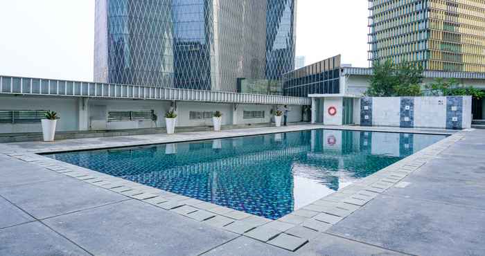 Swimming Pool  2BR Cozy @ The Empyreal Condominium Epicentrum Apartment By Travelio