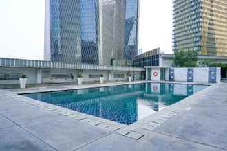 Swimming Pool  2BR Cozy @ The Empyreal Condominium Epicentrum Apartment By Travelio