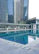 SWIMMING_POOL  2BR Cozy @ The Empyreal Condominium Epicentrum Apartment By Travelio