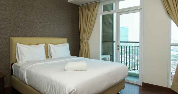 Bedroom Studio City View Apartment at Puri Orchard By Travelio