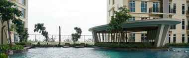 Swimming Pool 2 Studio Pool View Apartment at Puri Orchard By Travelio