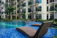 Lobby Studio Pool View Apartment at Puri Orchard By Travelio