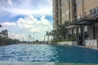 Swimming Pool 1BR Best Price at Apartment The Oasis By Travelio