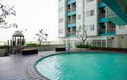 Swimming Pool 4 Studio Furnished with City View at The Nest Apartment By Travelio