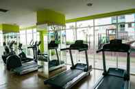 Fitness Center Studio Furnished with City View at The Nest Apartment By Travelio