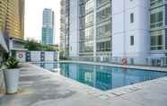 Bangunan 6 Modern 2BR Apartment at The Masterpiece Condominium Epicentrum By Travelio