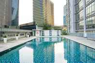 Swimming Pool Modern 2BR Apartment at The Masterpiece Condominium Epicentrum By Travelio