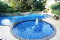 Swimming Pool 1BR Comfortable Near ITB University at Dago Suites Apartment By Travelio