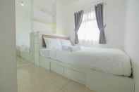 Bedroom 2BR with Mall Access at Green Pramuka Apartment By Travelio