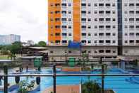 Swimming Pool 2BR with Mall Access at Green Pramuka Apartment By Travelio