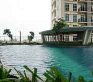 Kolam Renang 4 Minimalist and Relaxing 1BR at Puri Orchard By Travelio