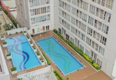 Swimming Pool 4 Cozy Studio at Taman Melati Margonda By Travelio